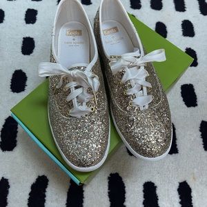 Kate Spade Keds in sparky gold. Never worn. Size 8.5.